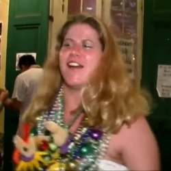 Mature lady lets her tits be of service for the boys at Mardi Gras